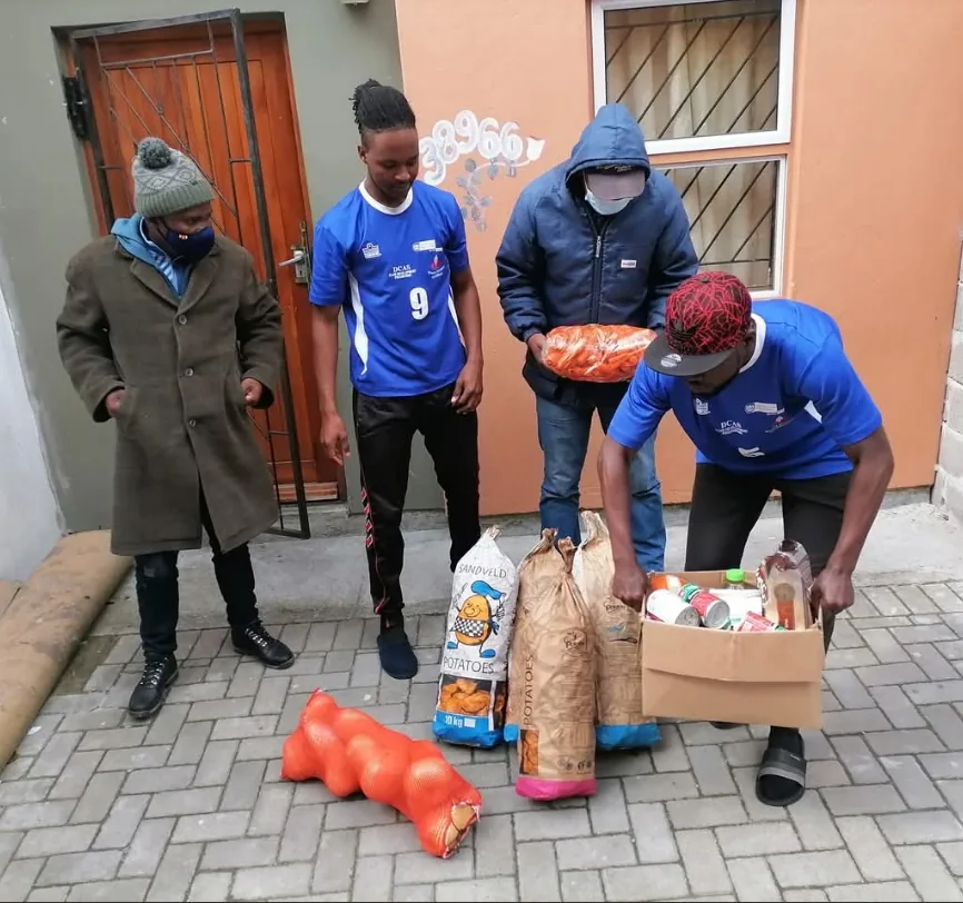 Thunderbolts volunteers preparing food and essentials for community relief